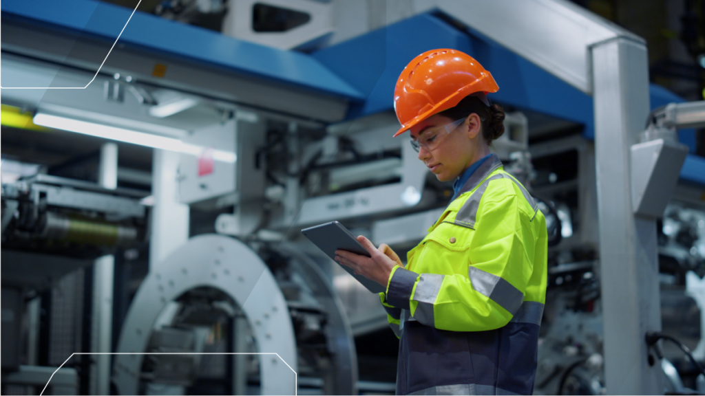 lady in a hard hat on an iPad