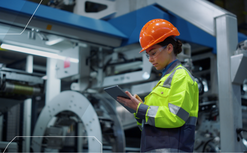 lady in a hard hat on an iPad