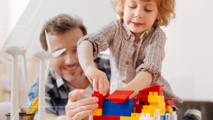 dad and child playing with large lego bricks