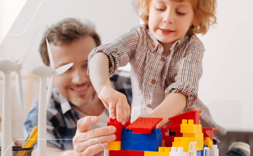 dad and child playing with large lego bricks